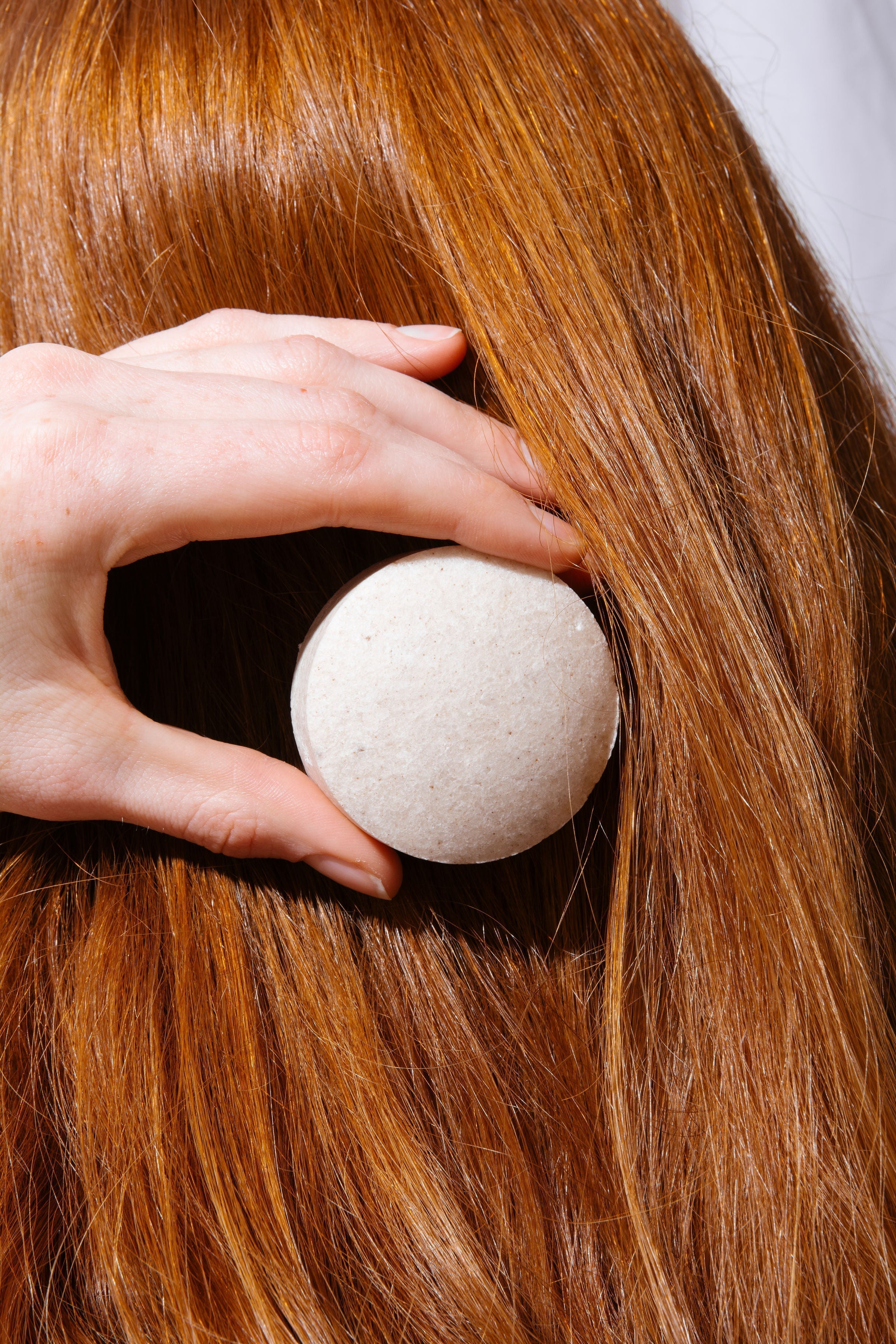 A woman with healthy hair because she is using The High-End Hippie Shampoo bars